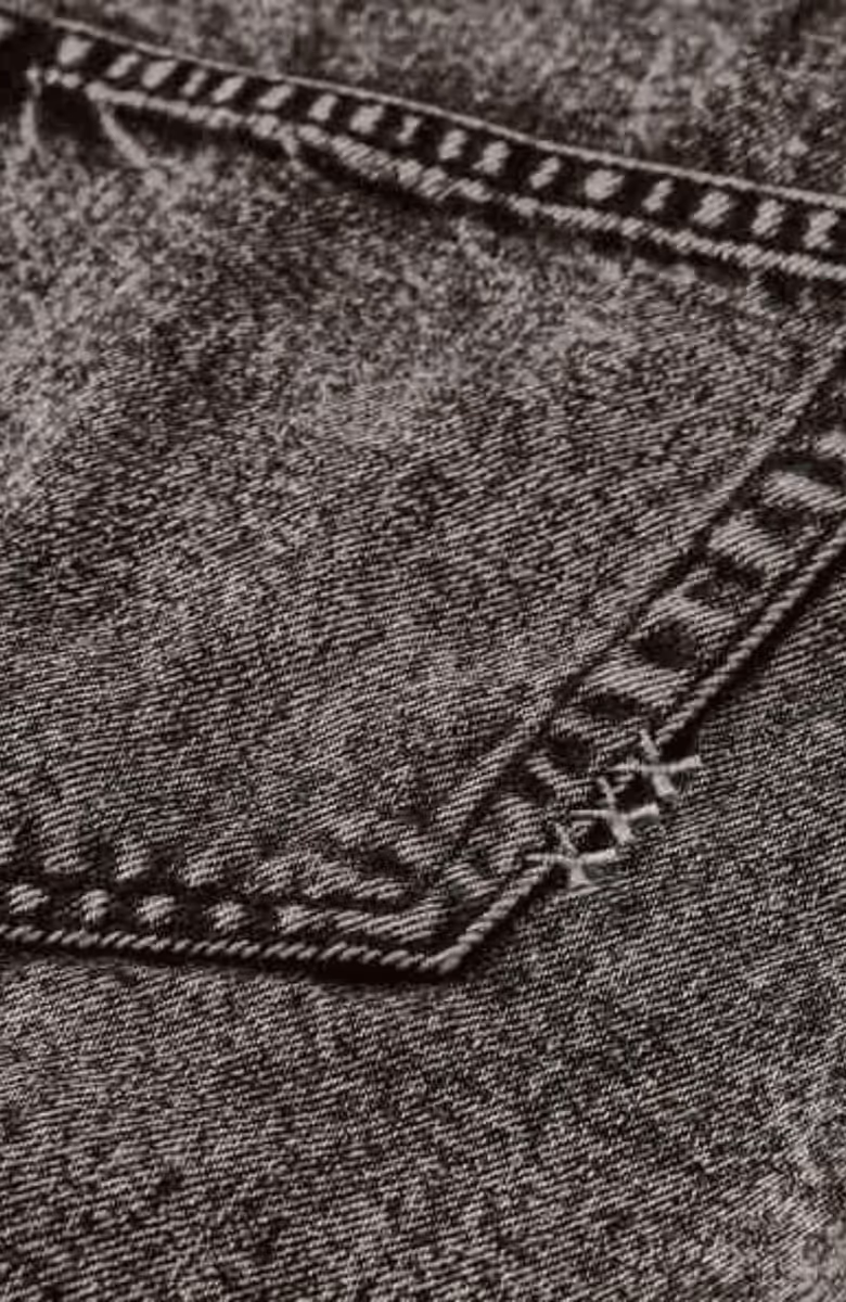 Seasonal fold over black denim skirt with wash effects
