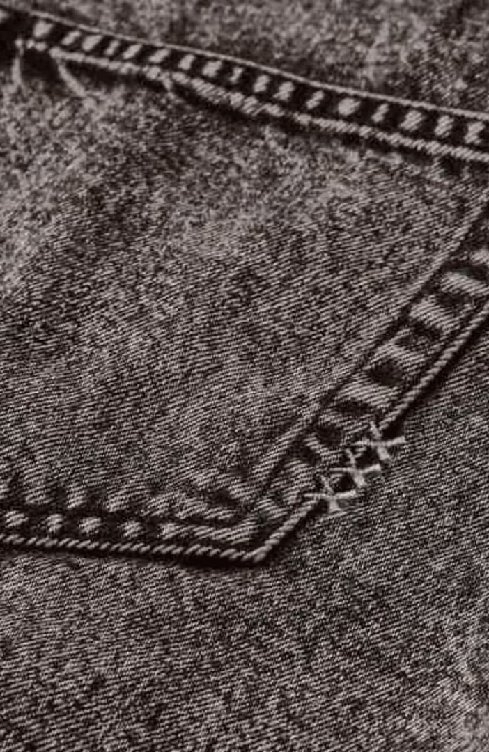 Seasonal fold over black denim skirt with wash effects