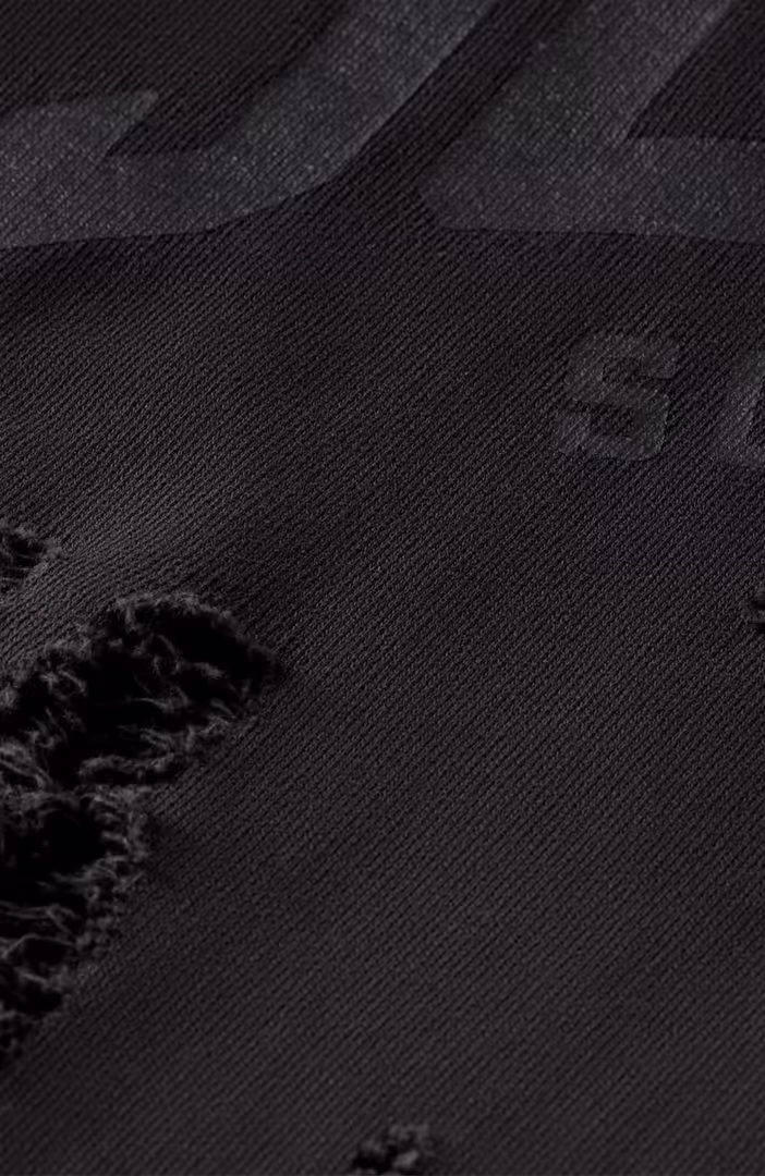 Sprayed hoodie with destroyed details